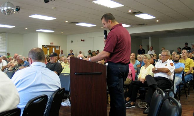 Andrew Duhs, Rescue 33 interim operations manager, speaks to the crowd at Pearce Community Center July 1. The Chillicothe City Council met for a special meeting to decide an ambulance service provider.