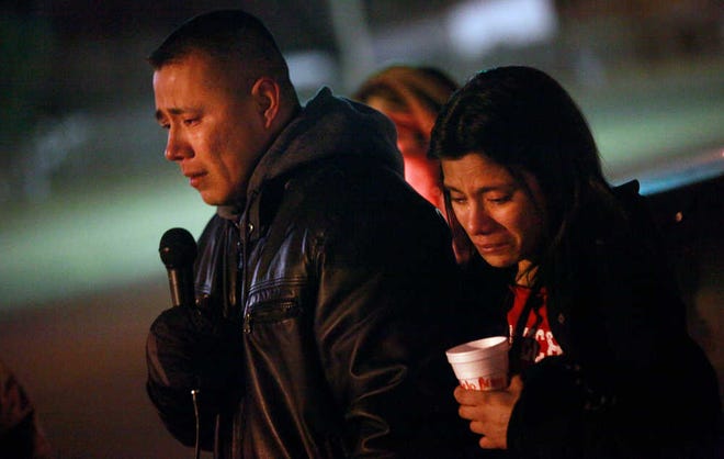 Alex Campos speaks of his missing daughter, Zoe, during a candlelight vigil at Trinity Christian Church on Dec. 12.