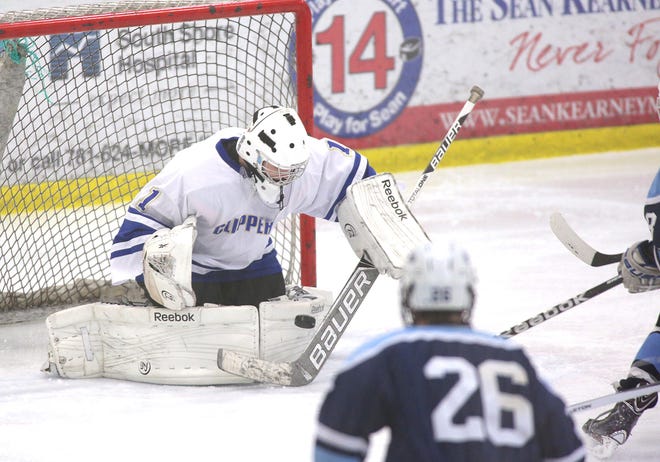 Norwell's goalie Sean McGowan stops a Scituate shot. Norwell faced Scituate at The Bog in Kingston, Friday, Dec. 27, 2103.