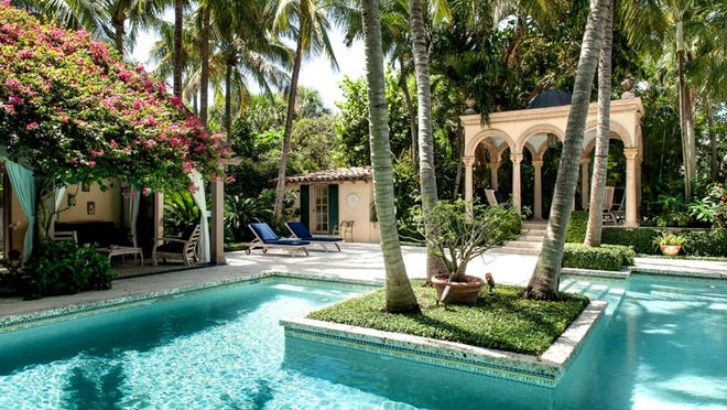 A freestanding arched pavilion is a focal point of the pool area behind Jon Stryker’s historic home, Tre Fontane, at 61 Middle Road, part of a 2.68-acre compound that includes Jimmy Buffett’s former residence at 540 S. Ocean Blvd. Stryker’s three-parcel property is listed for $47.8 million by the Corcoran Group.