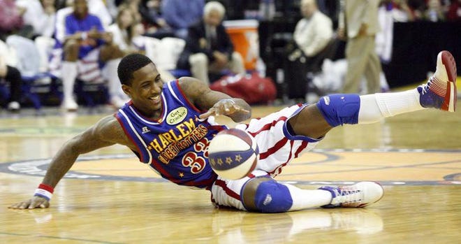 Bull Bullard dribbles the ball while spinning in circles last year at the Harlem Globetrotters game at the BMO Harris Bank Center in Rockford.