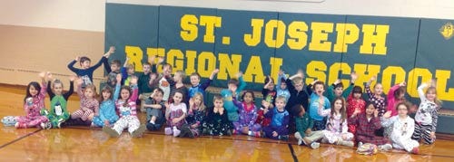 Allison Wefer photo - Students at St. Joseph Regional School in Newton dressed in their pajamas Dec. 13 to benefit Project Self-Sufficiency of Sussex County.