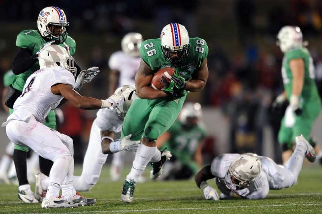 Marshall's Harold Hoskins (26) breaks away from Maryland's defense for a first down in the second half of the Military Bowl NCAA college football game on Friday, Dec. 27, 2013, in Annapolis, Md. Marshall won 31-20. (AP Photo/Gail Burton)