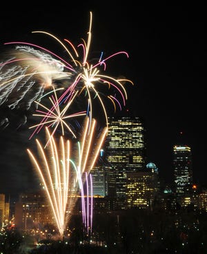 Fireworks explode over the Boston Common during first night festivities.