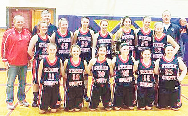 The Stark County Lady Rebels defeated Mt. Zion 60-51 Saturday to win the Monticello Holiday Tournament. Team members are, front from left, Willow Porter, Maranda Magnussen, Abby Masterson, Liz Hippen, Victoria West and Shelby Carter. Back row, assistant coach Tim Carstens, Molly Carlton, assistant coach Dustin Browning, Taylor VanWassenhove, Victoria Zavala, Ashley Phillips, Madisyn Paxson, Katrina Crowley, Jade Molln and head coach Scott Paxson.