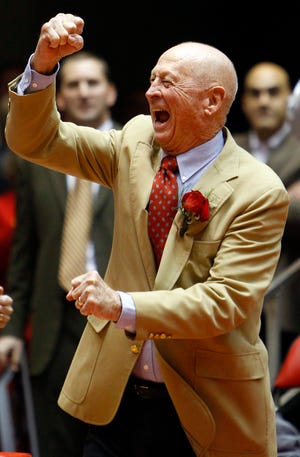 Former Iowa State coach Johnny Orr gestures to the crowd before an NCAA college basketball game against Kansas in 2011, in Ames, Iowa. The Taylorville native has died.