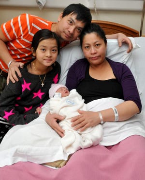 Thao Nguyen holds her newborn baby Alexandra Doan, 6 pounds, 7 ounces and 19 1/4 inches. Her husband is Hung Doan and 10-year-old daughter is Victoria. They are from Souderton.