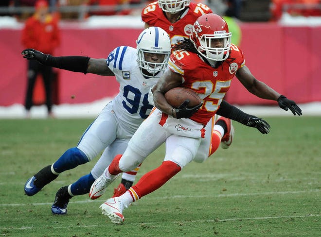 Kansas City's Jamaal Charles gained 106 yards on only 13 rushing attempts two weeks ago against Robert Mathis, left, and the Indianapolis Colts, but the Pro Bowl running back was given only five carries during the second half of the Colts' 23-7 victory.