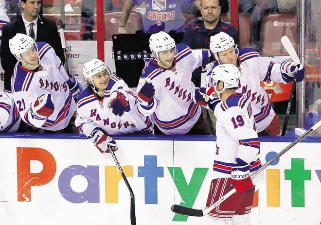 Rangers' Brad Richards (19) celebrates with teammates after he scored during the shootout against the Florida Panthers.