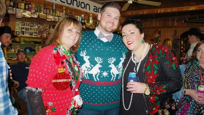 Grace Bartsch, Josh Council and Jamie Meuth got dressed up in their most festive attire for the Leon’s Christmas party.