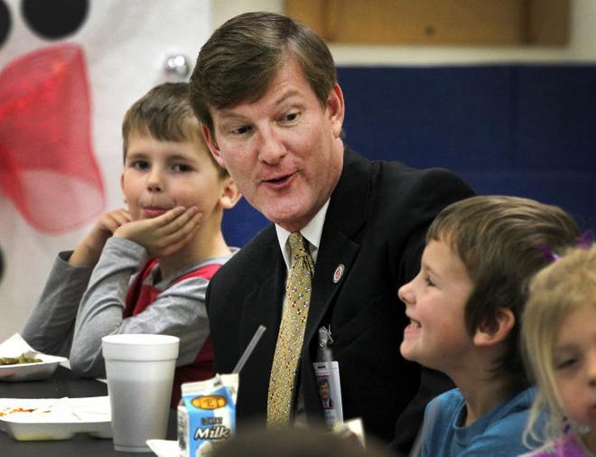 New Gaston County Schools Superintendent Jeff Booker talks with students as he eats lunch at Springfield Elementary in Stanley on Thursday.