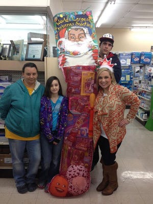 Leah Higdon won the stocking at Goudeau's Healthmart Pharmacy presented by Lucy Johnson.