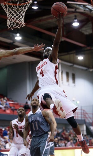 Nicholls' Jeremy Smith (4) drives to the basket during Thursday's game against New Orleans.