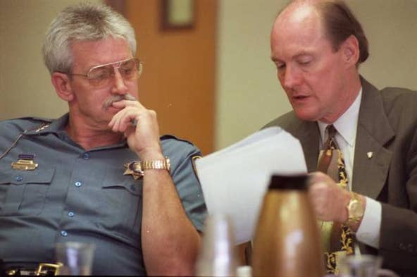 Shawnee County Sheriff Dave Meneley, left, was ousted from office Feb. 24, 2000, following a seven-day civil trial. Shawnee County District Judges Matthew Dowd and Richard Anderson said Meneley had engaged in "willful misconduct," perjuring himself twice and concealing evidence once.
Meneley since 1999 had been ensnared by a drug scandal in the department that became public after evidence surfaced in a KBI probe and district court hearings that narcotics investigator Timothy Oblander was hooked on cocaine and was consuming drugs from the sheriff's department property room.
Meneley denied under oath that he knew about Oblander's drug addiction and subsequently was charged with two counts of perjury. Defiant, Meneley appealed the ouster and ran for sheriff again but was defeated in the Republican primary.
