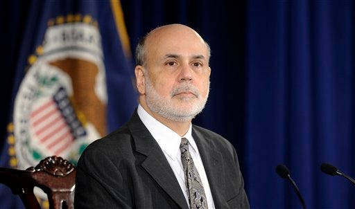 FILE - This Dec. 18, 2013 file photo shows Federal Reserve Chairman Ben Bernanke listening to a question during a news conference at the Federal Reserve in Washington. Bernanke said Friday, factors that have kept the economy from accelerating appear to be abating and he foresees stronger growth in 2014. Bernanke said Americans' finances have improved and the outlook for home sales is brighter. He also expects less drag from federal spending cuts and tax increases. Combined, those factors bode well for U.S. economic growth in coming quarters. (AP Photo/Susan Walsh, File)