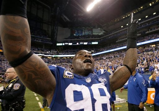 Indianapolis Colts' Robert Mathis (98) celebrates after an NFL wild-card playoff football game against the Kansas City Chiefs Saturday, Jan. 4, 2014, in Indianapolis. Indianapolis defeated Kansas City 45-44. The Colts will face the Patriots in Foxboro next weekend in the AFC divisional round.