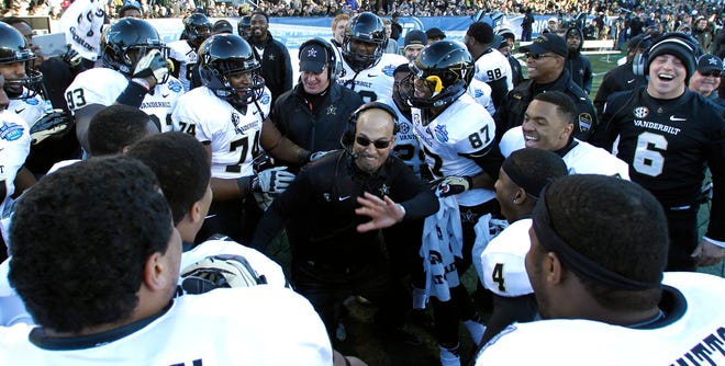Vanderbilt coach James Franklin celebrates with team as he dances on the sideline during the second half of the BBVA Compass Bowl NCAA college football game on Saturday, Jan. 4, 2014, in Birmingham, Ala. Vanderbilt defeated Houston 41-24.