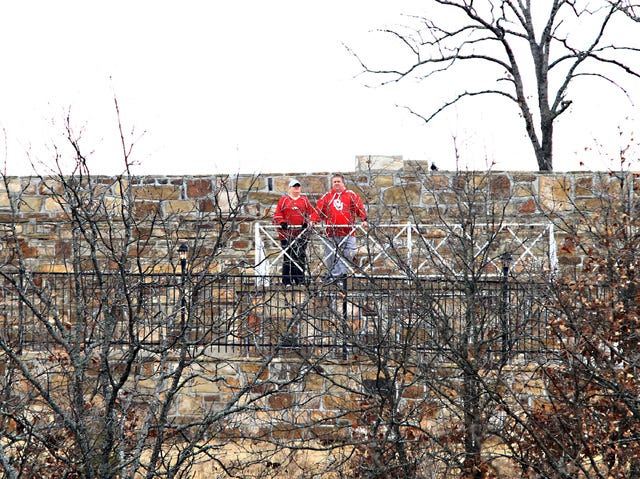 Jamie Mitchell • Times Record - Stacey and Gary Pope of Barling take in the view of Fort Smith on Saturday, Jan. 4, 2014, from the lower platform of the McClure Amphitheater. Located off of Massard Road in Chaffee Crossing, the observation site was built in 1953 and was used by soldiers stationed at Camp Chaffee for map-reading classes, occasional church services and other events.