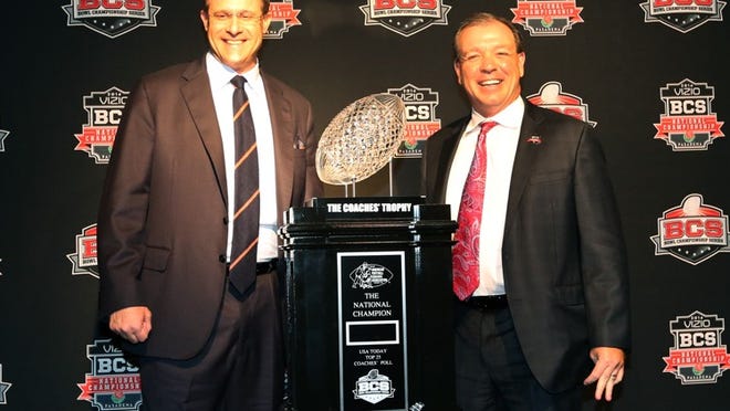 Jan 5, 2014; Los Angeles, CA, USA; Auburn Tigers head coach Gus Malzahn (left) and Florida State Seminoles head coach Jimbo Fisher pose for photos with the Coaches' Trophy at Newport Beach Marriott. Mandatory Credit: Matthew Emmons-USA TODAY Sports