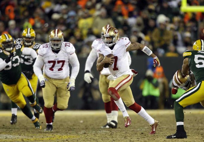 San Francisco 49ers quarterback Colin Kaepernick (7) runs against Green Bay Packers defense during the first half of an NFL wild-card playoff football game, Sunday, Jan. 5, 2014, in Green Bay, Wis. (AP Photo/Jeffrey Phelps)