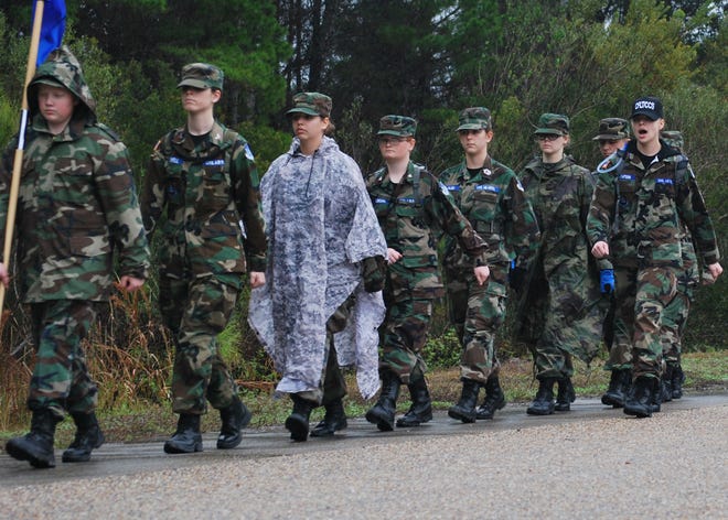 Civil Air Patrol cadets march in the rain Jan. 2, at Silver Flag on Tyndall. Cadets take part in an annual winter encampment training exercise where they learn military customs and courtesies and leadership skills.