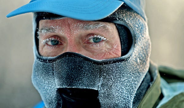 John Brower snow in his eye lashes after running to work in the frigid -20 weather Monday, Jan. 6, 2014 in Minneapolis. A whirlpool of frigid, dense air known as a "polar vortex" descended Monday into much of the U.S.