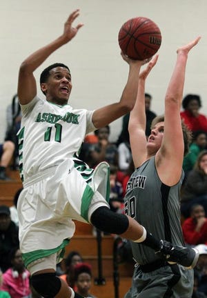 Ashbrook's Tristen Rodriguez drives to the basket past Forestview's Hal Stowe during their game Tuesday night at Ashbrook High School.