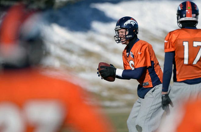 Denver Broncos quarterback Peyton Manning (18) practices with the team at Dove Valley as they prepare for an NFL football game against the San Diego Chargers in the Divisional Round of the Playoffs on Jan. 6, 2014, in Englewood, Colo. (AP Photo/The Denver Post, John Leyba) MAGS OUT; TV OUT; INTERNET OUT; NO SALES; NEW YORK POST OUT; NEW YORK DAILY NEWS OUT