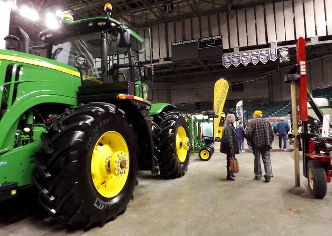 Visitors to the Topeka Farm Show view farm equipment Tuesday inside Landon Arena at the Kansas Expocentre. About 3,500 people were expected to attend during the three-day event.