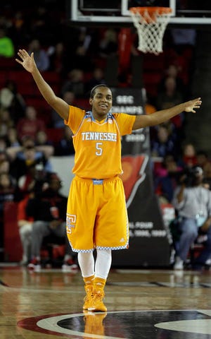 Tennessee guard Ariel Massengale (5) reacts in the closing moments of the second half of an NCAA college basketball game against Georgia, Sunday, Jan. 5, 2014, in Athens, Ga. Tennessee won 85-70. (AP Photo/John Bazemore)