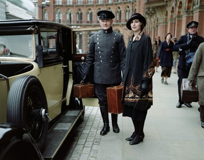 Have your chauffeur fetch the guests for your very own “Downton” party; above is Laura Carmichael as Lady Edith in a scene from the fourth season.