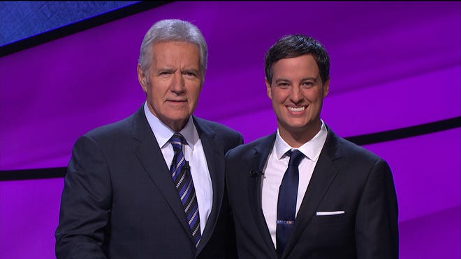Andrew Nelson of New Bedford stands with Alex Trebek, host of Jeopardy! Nelson appeared on the show Jan. 7 and 8.