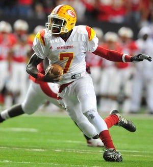 David Manning/Staff Clarke Central quarterback Martay Mattox runs the ball late in the first half to set up a field goal as the Clarke Central Gladiators face the Sandy Creek Fighting Patriots in the GHSA class AAAA state championship at the Georgia Dome on Friday, Dec. 11, 2009 in Atlanta, Ga.