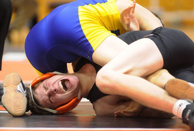 Pennsbury's Brandon McKee is pinned by Downingtown East's James Strommer in the 106 lb weight class during their match on Thursday night at Pennsbury high school. Both McKee and Pennsbury lost the match.