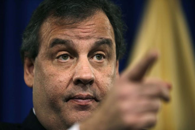 New Jersey Gov. Chris Christie gestures during a news conference Thursday, Jan. 9, 2014, at the Statehouse in Trenton, N.J. Christie has fired a top aide who engineered political payback against a town mayor, saying she lied. Deputy Chief of Staff Bridget Anne Kelly is the latest casualty in a widening scandal that threatens to upend Christie's second term and likely run for president in 2016. Documents show she arranged traffic jams to punish the mayor, who didn't endorse Christie for re-election. (AP Photo/Mel Evans)