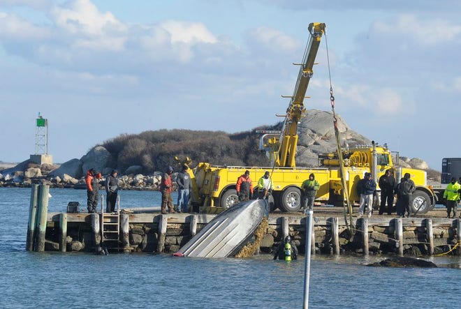 A wider view of the pier where the duck hunters' boat was hauled out of the water shows a piece of land called the Knubble rising from behind the heavy-duty tow truck used to lift the boat.