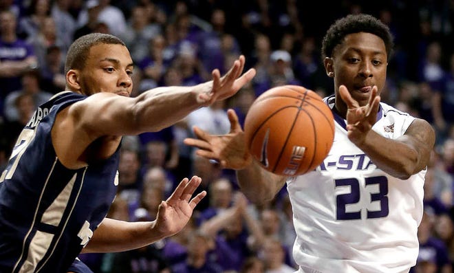 Kansas State's Nigel Johnson (23) chases a loose ball during the second half of the Wildcats' 72-55 victory over George Washington earlier this season.