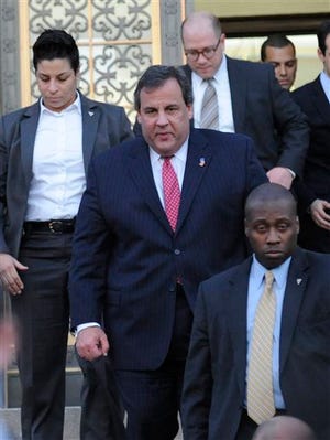 New Jersey Gov. Chris Christie leaves City Hall Thursday, Jan. 9, 2014, in Fort Lee, N.J. Christie traveled to Fort Lee to apologize in person to Mayor Mark Sokolich. Moving quickly to contain a widening political scandal, Christie fired one of his top aides Thursday and apologized repeatedly for the "abject stupidity" of his staff, insisting he had no idea anyone around him had engineered traffic jams to get even with a Democratic mayor. (AP Photo/Louis Lanzano)