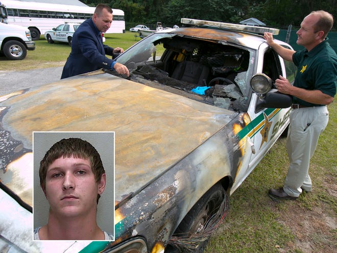 In this Nov. 7, 2013 file photo, Marion County sheriff's Capt. Jimmy Pogue, left, and Lt. Brian Dotten look over a patrol car damaged by an arsonist. Dylan Martin, inset, faces charges in connection with several arsons involving vehicles, including police cars.