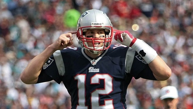 New England Patriots quarterback Tom Brady (12), gestures during NFL game between Miami Dolphins and New England Patriots Sunday afternoon, Dec 15, 2013 at Sun Life Stadium in Miami Gardens.(Bill Ingram/Palm Beach Post)