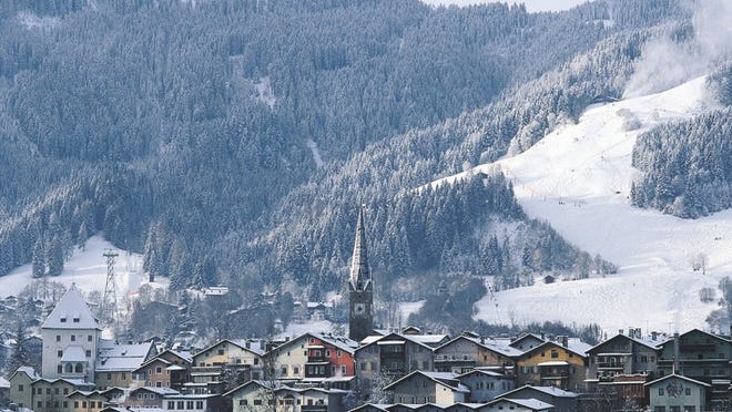 The notorious Hahnenkamm ski slopes rise behind Kitzbuehel, Austria. Courtesy of the Austrian National Tourist Office