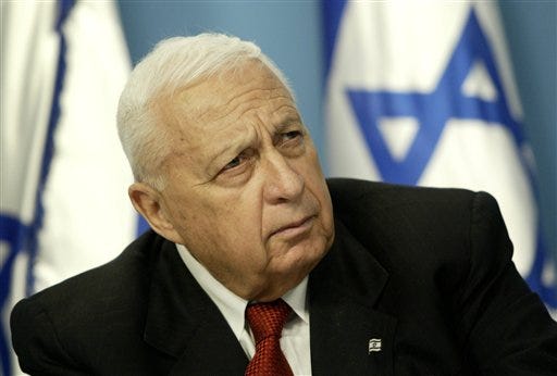 Israeli Prime Minister Ariel Sharon paused during a news conference in his Jerusalem office regarding education reform. Israeli media outlets are reporting that Sharon died Saturday at the age of 85.