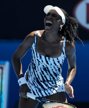 Venus Williams of the U.S. reacts during her first round match against Ekaterina Makarova of Russia at the Australian Open tennis championship in Melbourne, Australia, Monday, Jan. 13, 2014. (AP Photo/Andrew Brownbill)