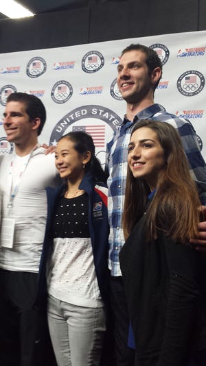 The 2014 Olympic pairs figure skating teams appear at a news conference Sunday where the selections for Sochi were annouced. At left, Nathan Bartholomay and Felicia Zhang, and Simon Shnapir and Cranston native Marissa Castelli react to the news that they'll be competing in Sochi.