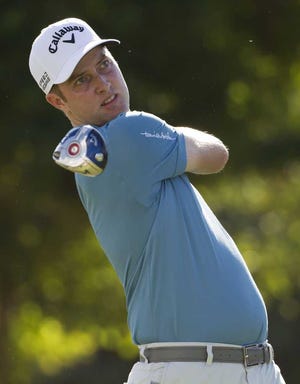 Chris Kirk hits off the first tee during the third round of the Sony Open golf tournament at Waialae Country Club, Saturday, Jan. 11, 2014, in Honolulu. (AP Photo/Eugene Tanner)