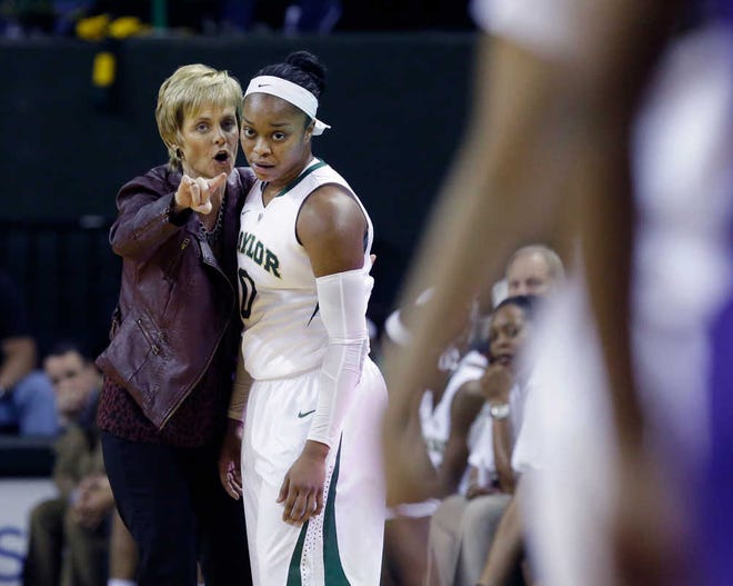 Baylor head coach Kim Mulkey, left, gives directions to Baylor guard Odyssey Sims (0) during the first half of an NCAA college basketball game against TCU, Saturday, Jan. 11, 2014, in Waco, Texas. (AP Photo/LM Otero)