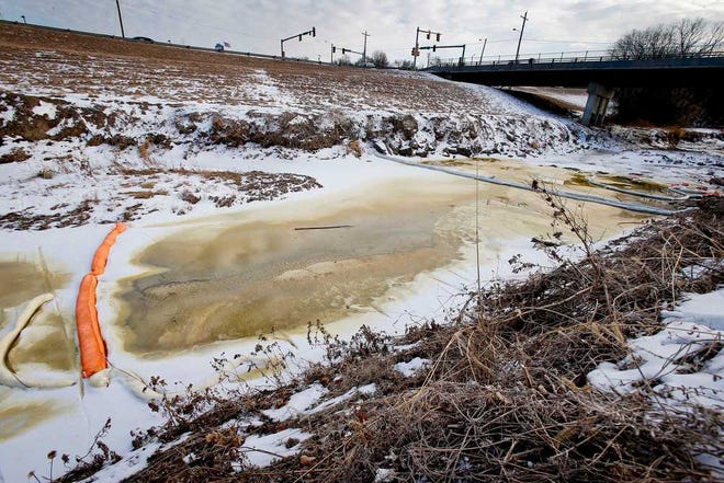 Diesel fuel sits this past week in a contained section of the Shunga Creek near S.E. 15th and Adams. On Monday, Kansas Department of Health and Environment spokeswoman Miranda Steele said a contractor had recovered about 1,500 gallons of the fuel and water mixture from the creek.