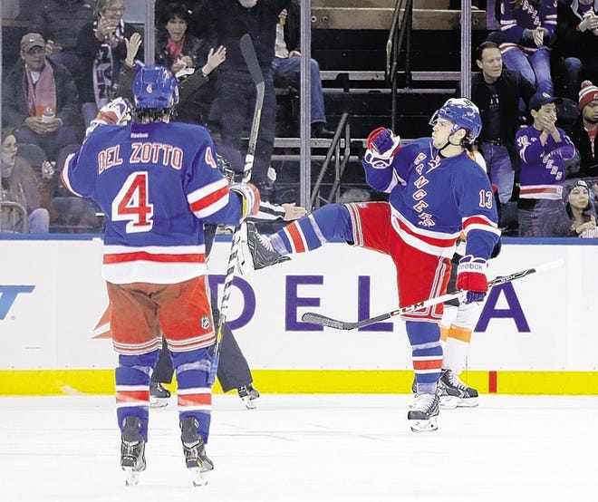 Rangers' Daniel Carcillo, right, celebrates with Michael Del Zotto after scoring in the first period.