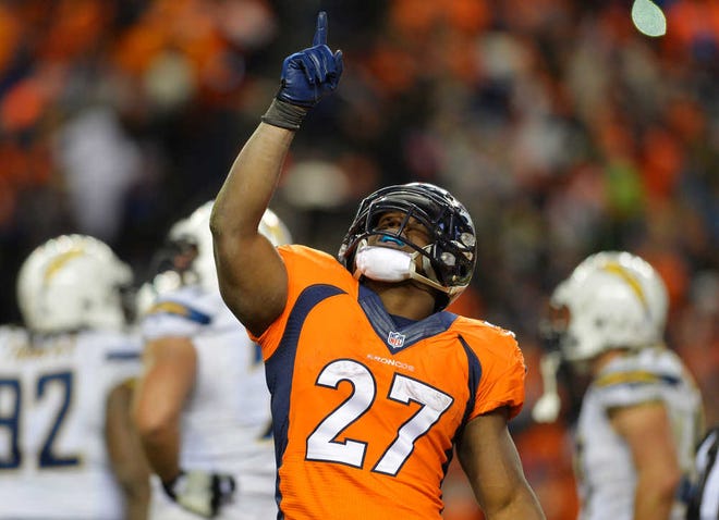 Denver Broncos running back Knowshon Moreno reacts after scoring a touchdown on a three-year run against the San Diego Chargers in the fourth quarter of an NFL AFC division playoff football game, Sunday, Jan. 12, 2014, in Denver. (AP Photo/Jack Dempsey)