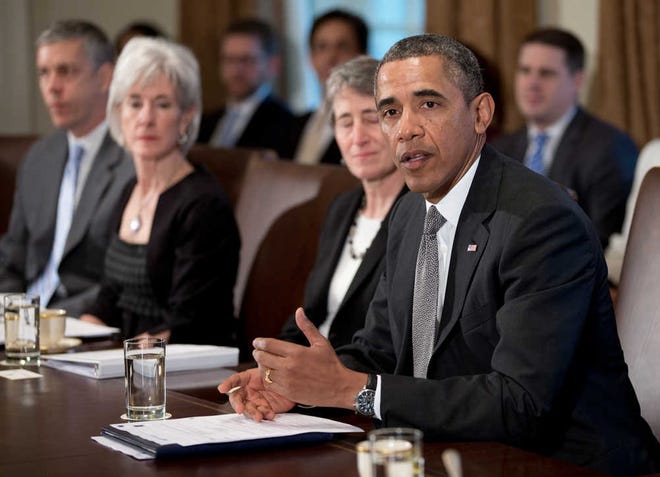 President Barack Obama speaks to the media before meeting with members of his Cabinet.